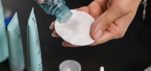 A man putting toner on a cotton pad