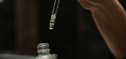A woman holding a serum