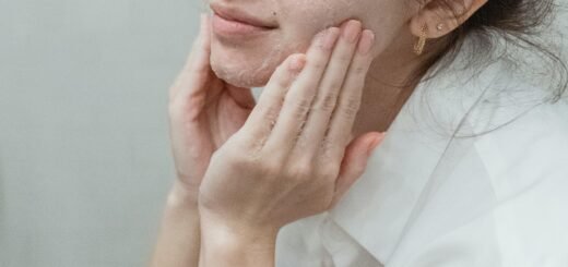 A person putting their hands on their face